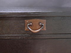 Close-up hand-hammered copper drawer pull.